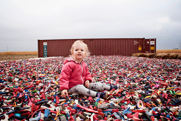 A 50' x 50' area full of cut up Croc's - DIY industrial bounce house? 